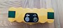 Der Morpilot Akku für den iRobot Roomba von oben. Gelb mit grünen Laschen und den Kontakten. - © Lifetester.net