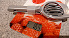 The Westmark slicer is placed on a kitchen scale, showing a weight of 165 grams.