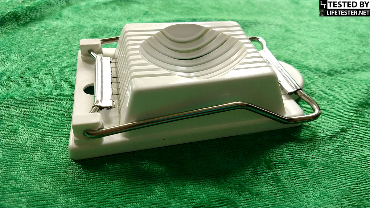 Metaltex egg slicer from a slightly angled top view, displaying the design and cutting mechanism.